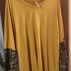Gorgoues mustard colored top with detailed sleeves